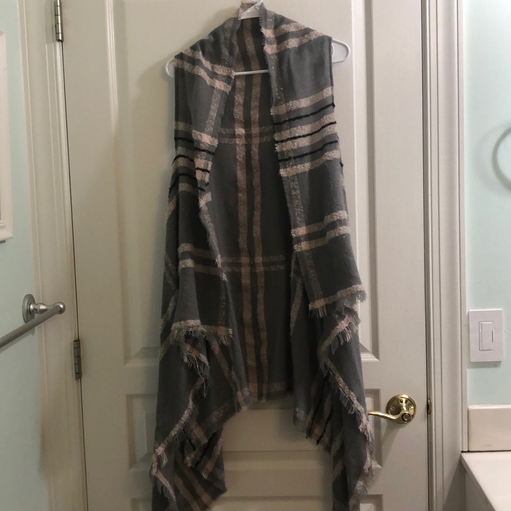 Francesca’s long sleeveless cardigan